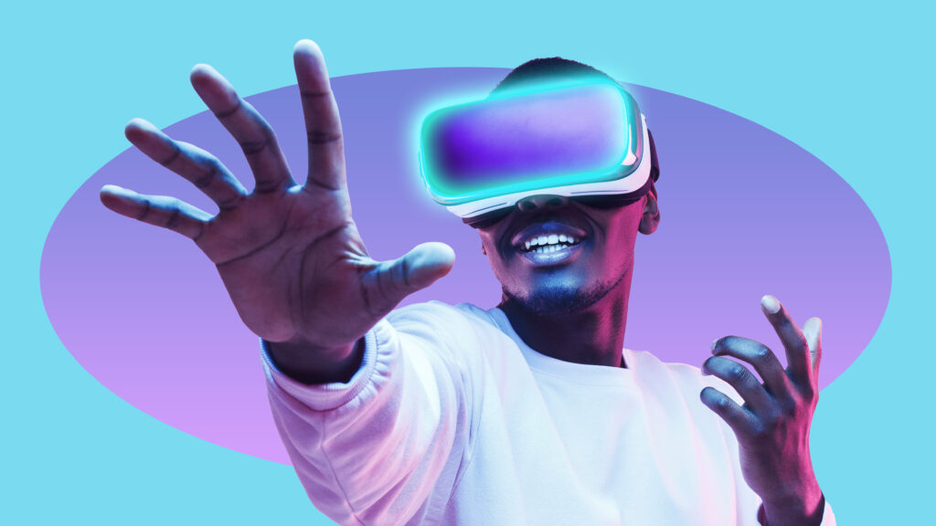 homme avec casque de réalité virtuelle, main tendue sur fond bicolore - le digital learning